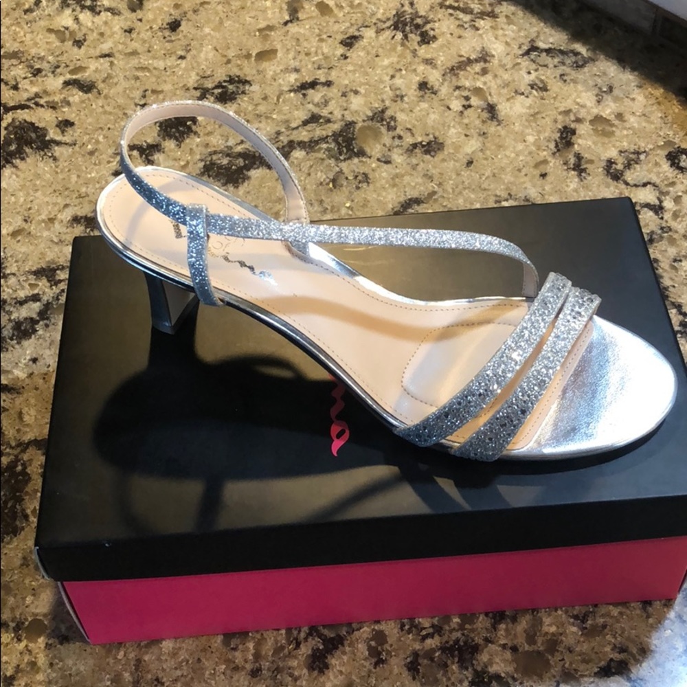 Brand new. Never worn heels.